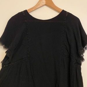 Black top with fringe design